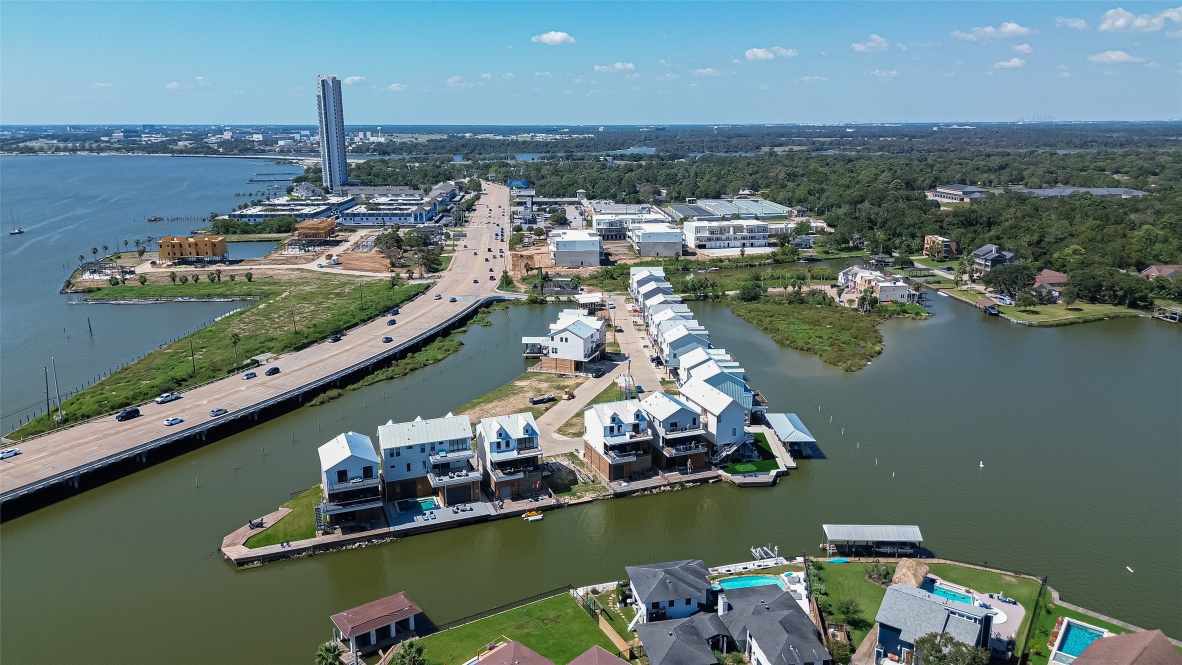 34 Commander Runco Lane Seabrook, TX 77586 - Photo 2 of 35 an aerial view of a houses with a lake view