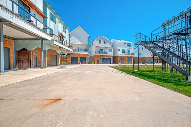 an aerial view of a house with a lake view