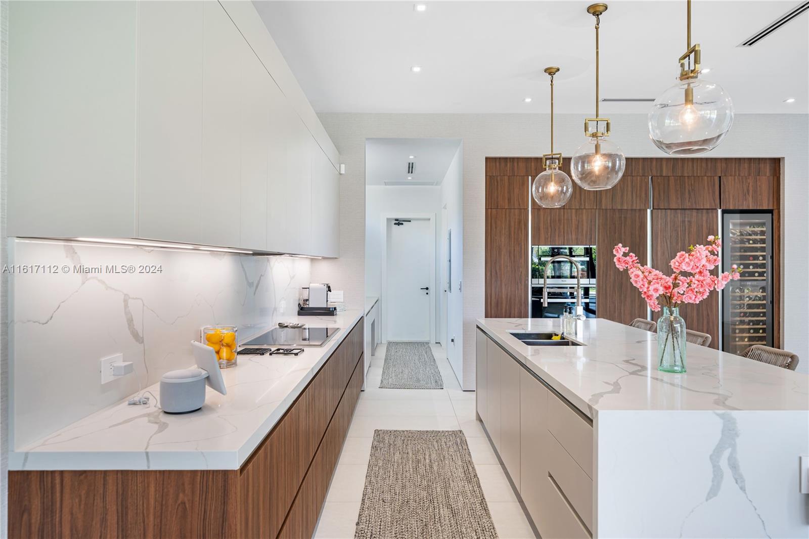 7825 Southwest 128th Street Pinecrest, FL 33156 - Photo 11 of 40 a kitchen with granite countertop a sink stove and cabinets