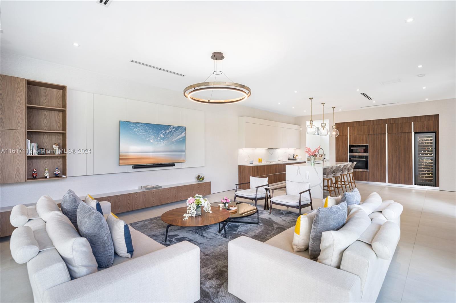 7825 Southwest 128th Street Pinecrest, FL 33156 - Photo 13 of 40 a living room with furniture and a wooden floor