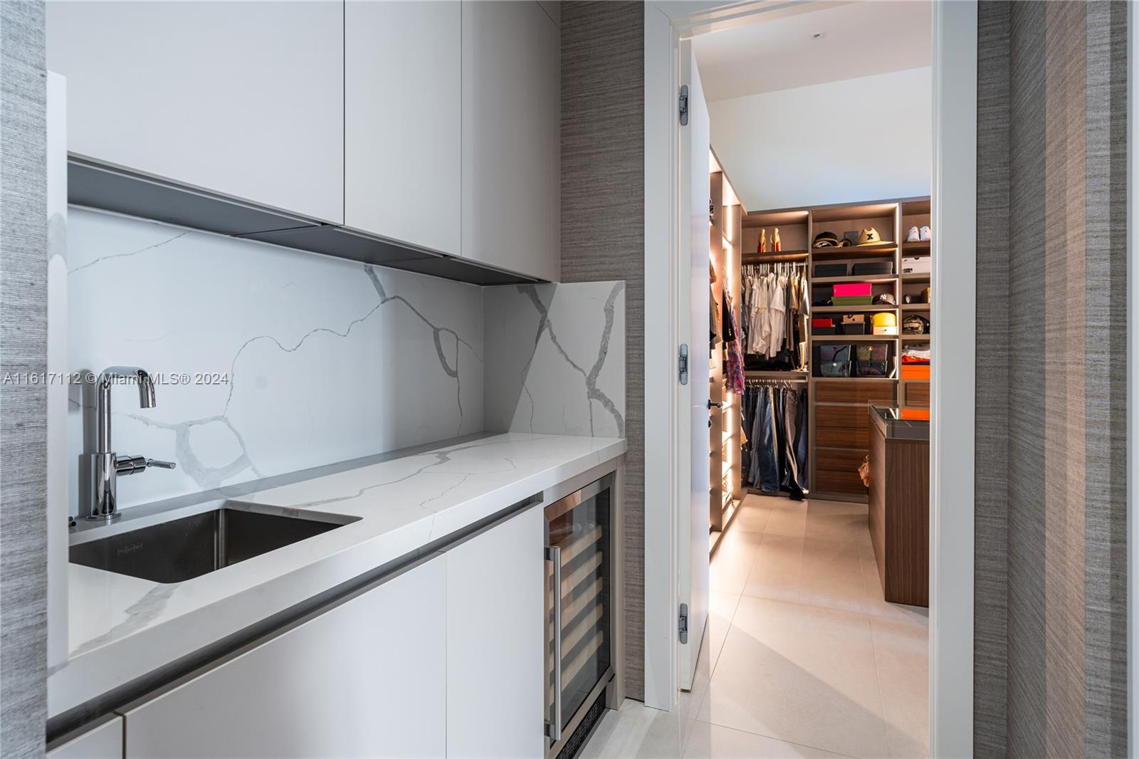 7825 Southwest 128th Street Pinecrest, FL 33156 - Photo 29 of 40 a kitchen with a sink and a refrigerator
