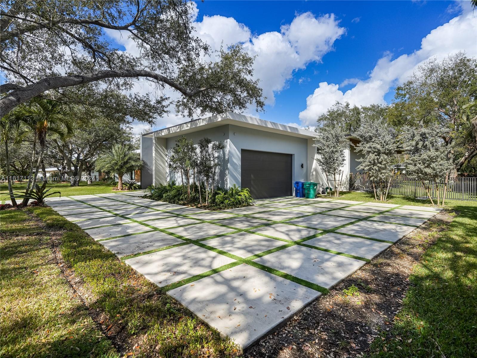 7825 Southwest 128th Street Pinecrest, FL 33156 - Photo 36 of 40 a view of the house with yard and tree s
