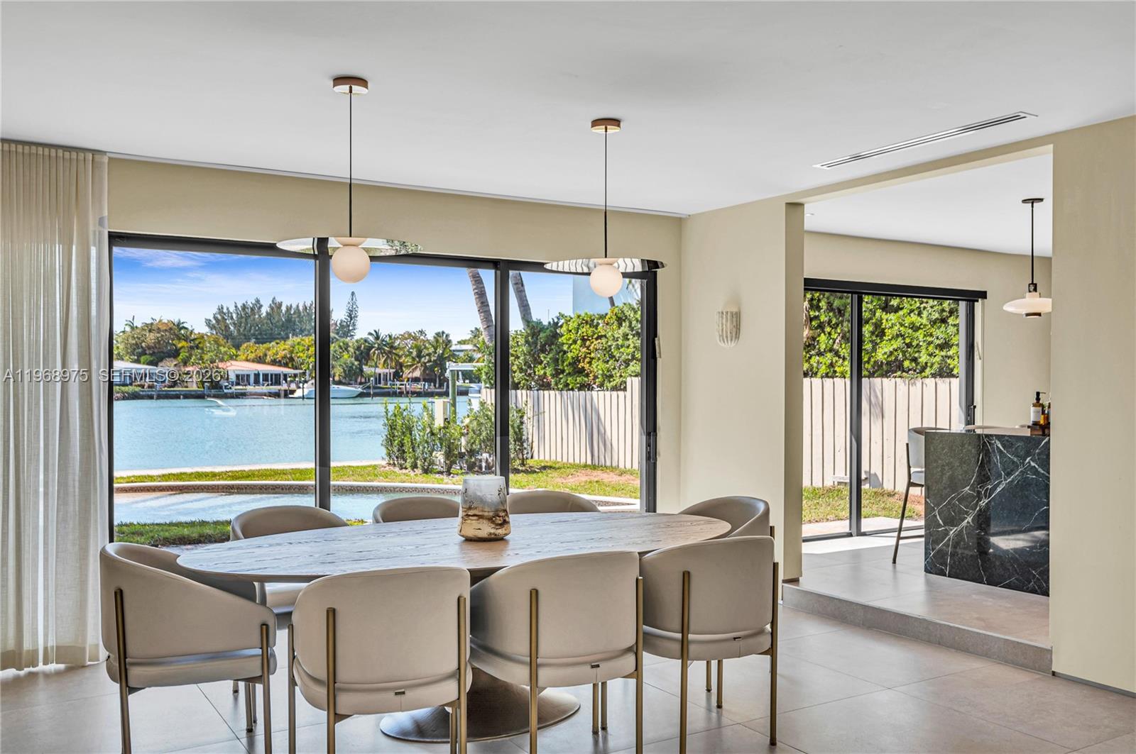 1170 South Biscayne Point Road Miami Beach, FL 33141 - Photo 13 of 48 a view of a dining room with furniture window and outside view