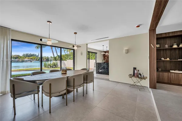 a view of a dining room with furniture window and outside view