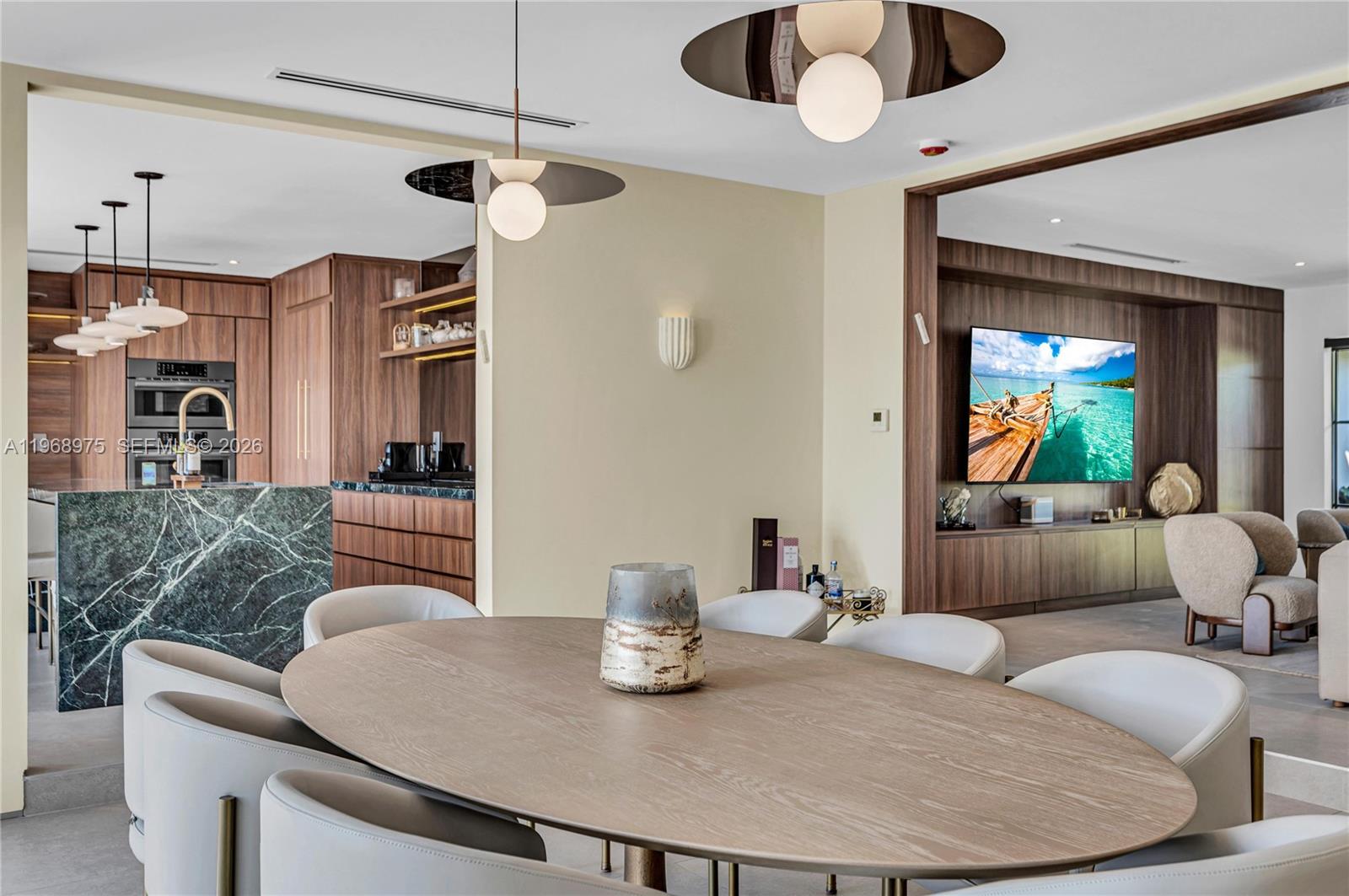 1170 South Biscayne Point Road Miami Beach, FL 33141 - Photo 15 of 48 a living room with furniture and a chandelier