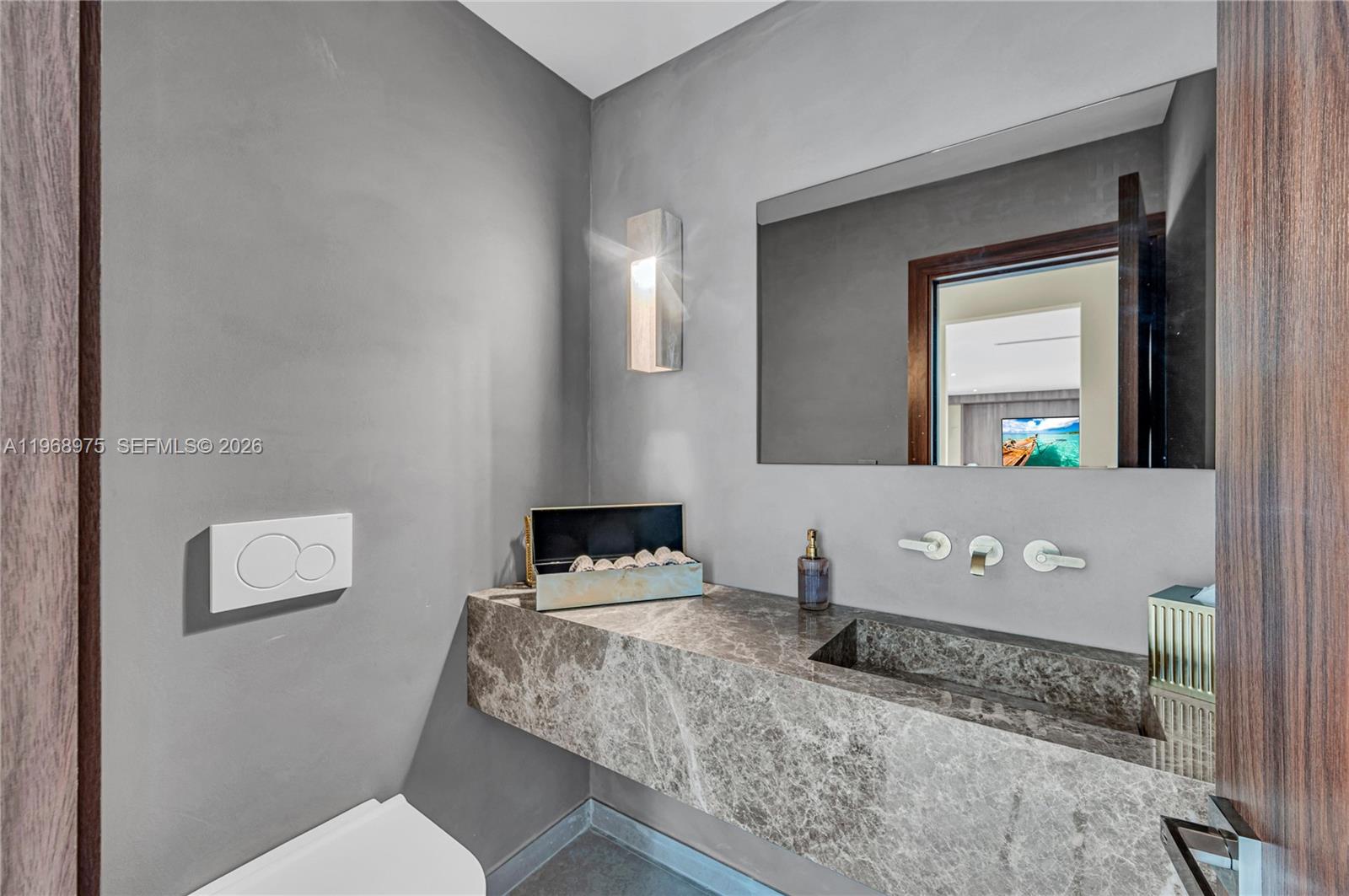 1170 South Biscayne Point Road Miami Beach, FL 33141 - Photo 18 of 48 a bathroom with a granite countertop sink and a mirror