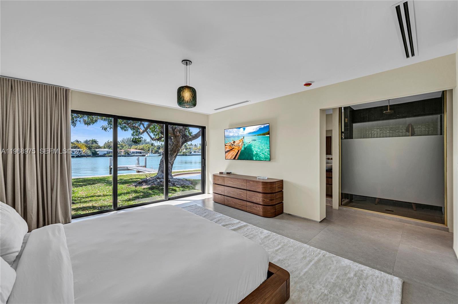 1170 South Biscayne Point Road Miami Beach, FL 33141 - Photo 21 of 48 a bedroom with furniture and a large window