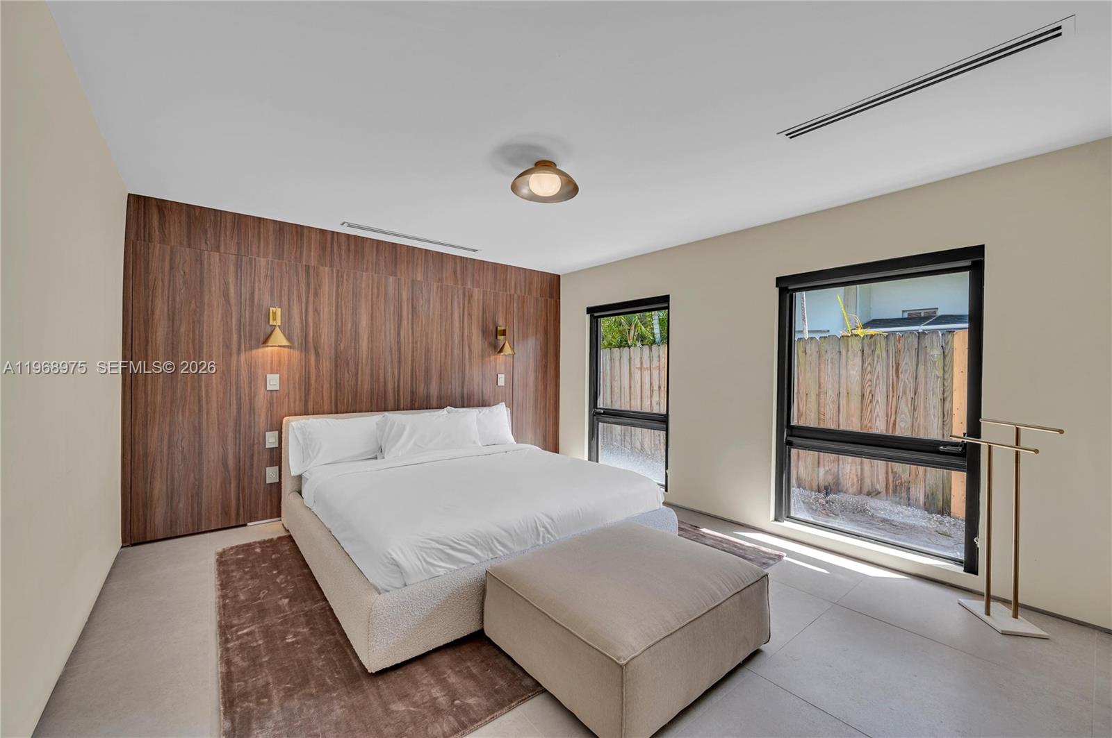 1170 South Biscayne Point Road Miami Beach, FL 33141 - Photo 30 of 48 a bedroom with a bed and a window