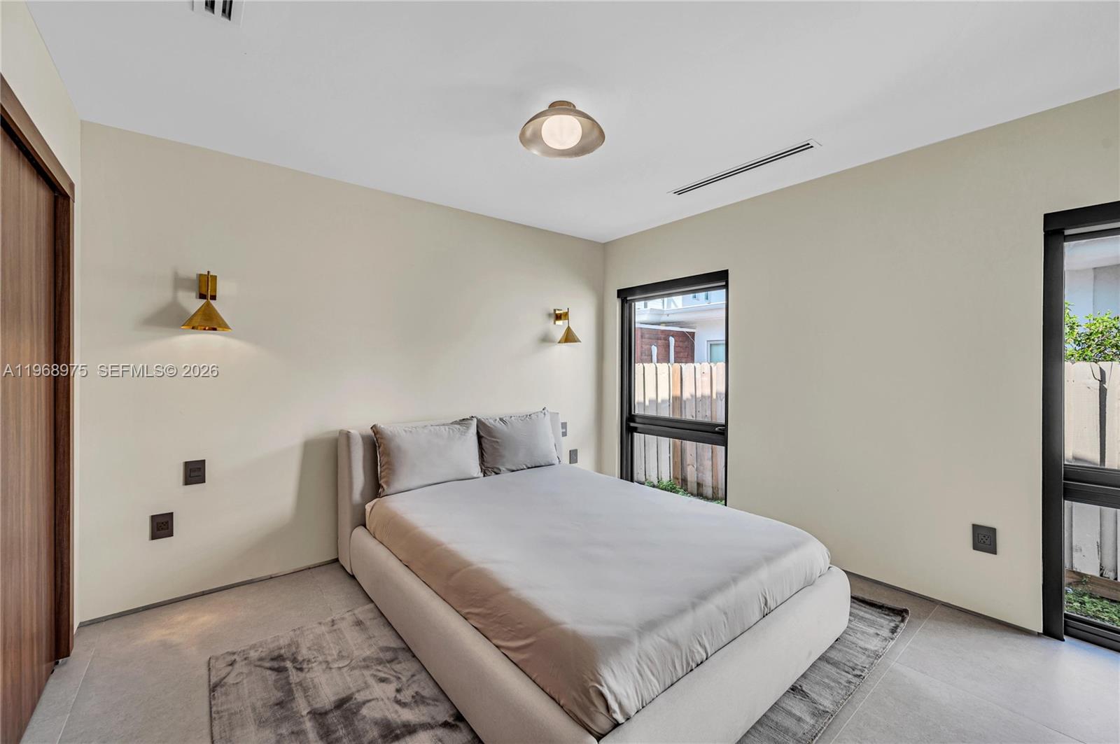 1170 South Biscayne Point Road Miami Beach, FL 33141 - Photo 34 of 48 a bedroom with a bed and a window