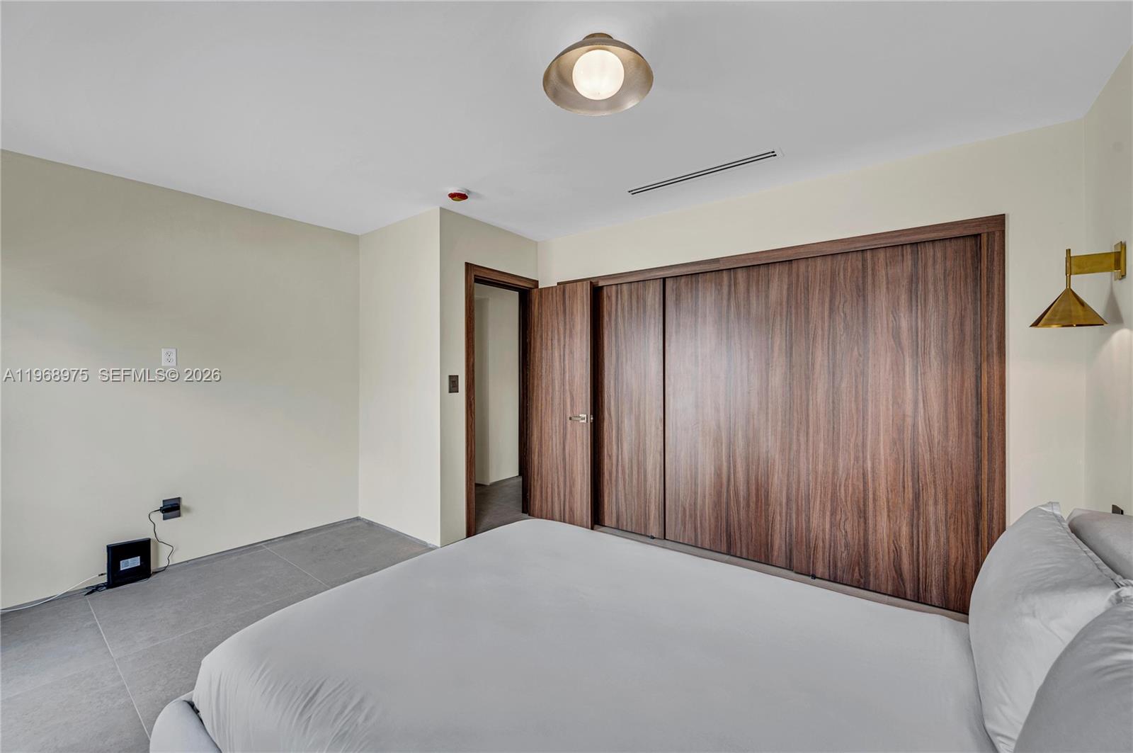 1170 South Biscayne Point Road Miami Beach, FL 33141 - Photo 35 of 48 a bedroom with a bed and a window