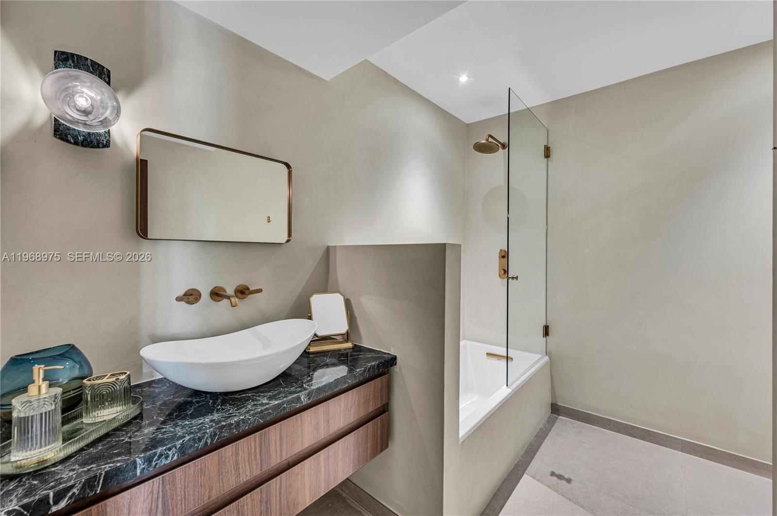 1170 South Biscayne Point Road Miami Beach, FL 33141 - Photo 36 of 48 a bathroom with a granite countertop sink a toilet and bathtub