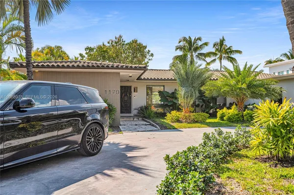 a car parked in front of a house
