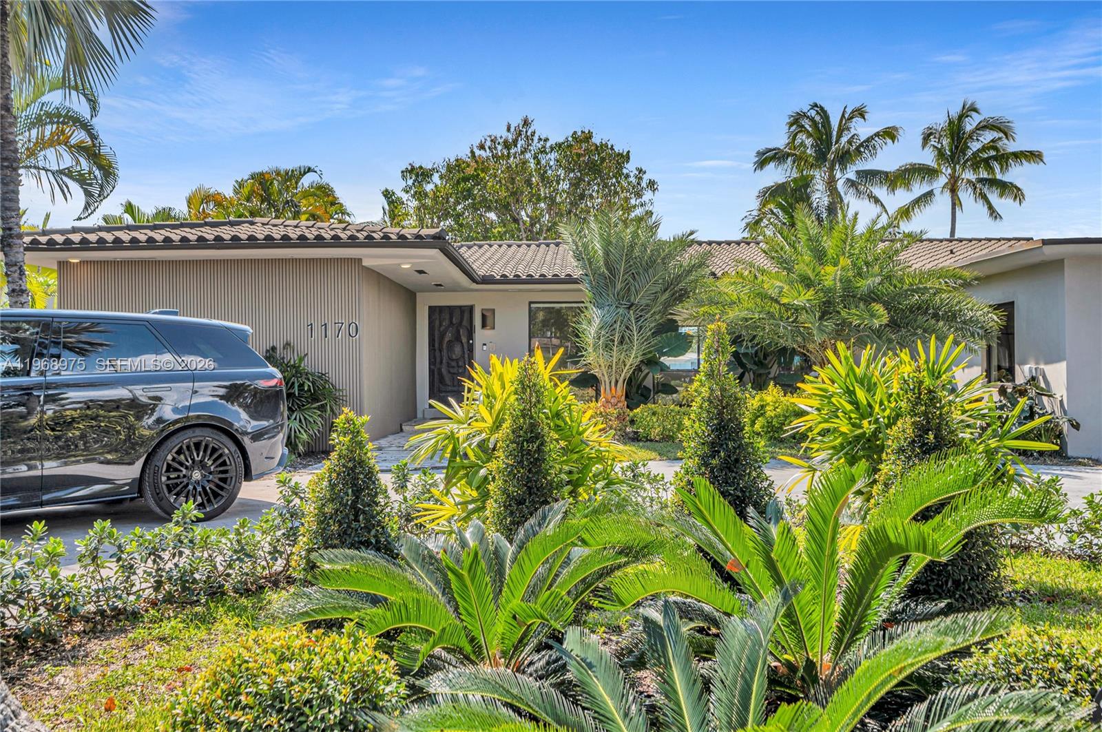 1170 South Biscayne Point Road Miami Beach, FL 33141 - Photo 39 of 48 a view of a house with a garden