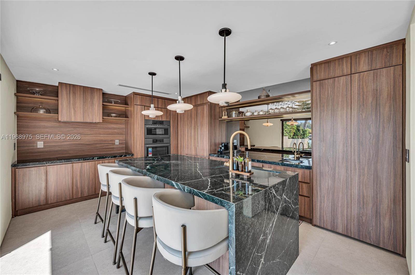 1170 South Biscayne Point Road Miami Beach, FL 33141 - Photo 4 of 48 a view of a dining room with furniture window and outside view