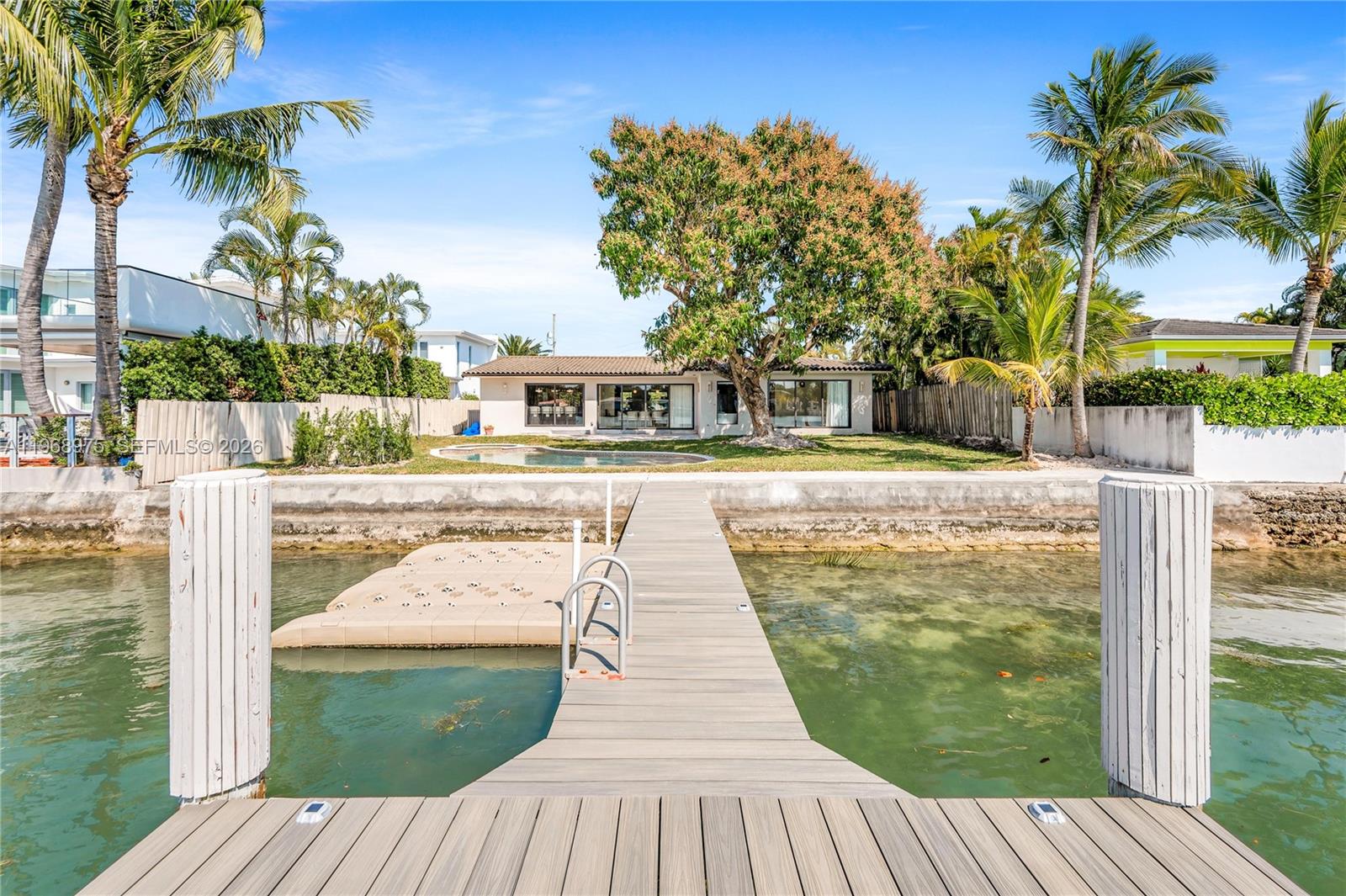 1170 South Biscayne Point Road Miami Beach, FL 33141 - Photo 43 of 48 a view of a swimming pool with a patio