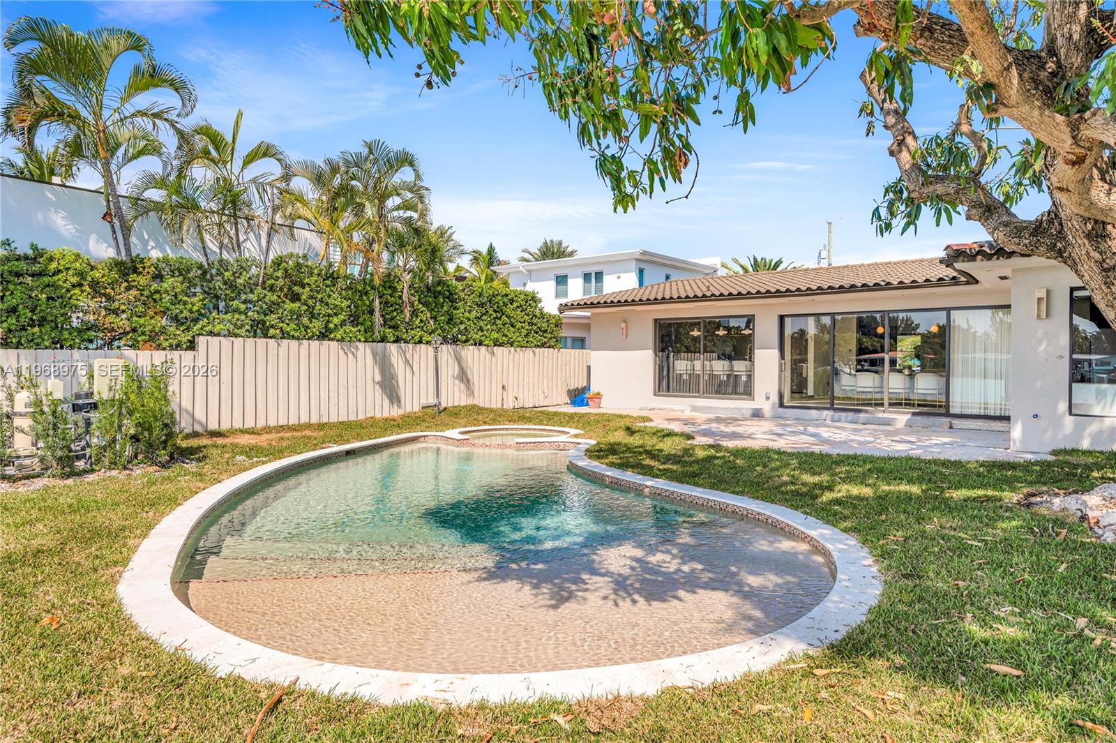 1170 South Biscayne Point Road Miami Beach, FL 33141 - Photo 44 of 48 a view of swimming pool with a garden