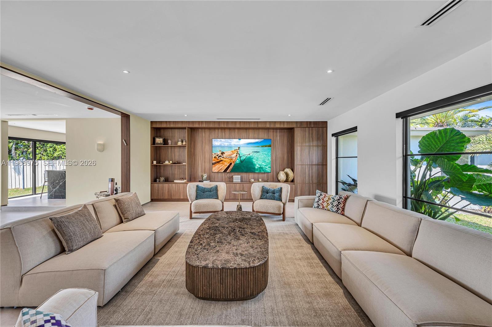 1170 South Biscayne Point Road Miami Beach, FL 33141 - Photo 8 of 48 a living room with furniture and a large window