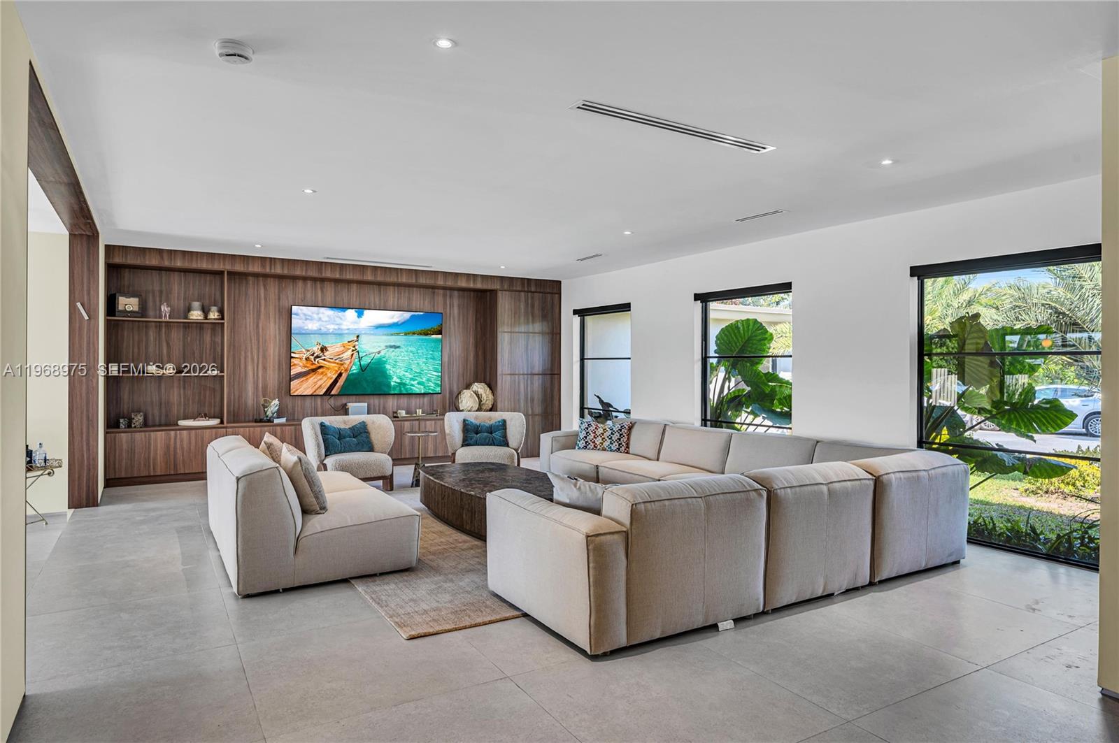 1170 South Biscayne Point Road Miami Beach, FL 33141 - Photo 9 of 48 a living room with fireplace furniture and a large window