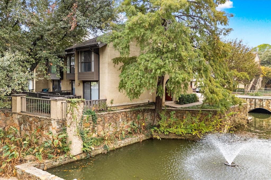 4501 North O'Connor Road, Unit 1111 Irving, TX 75062 - Photo 1 of 1 Back of house featuring a water view