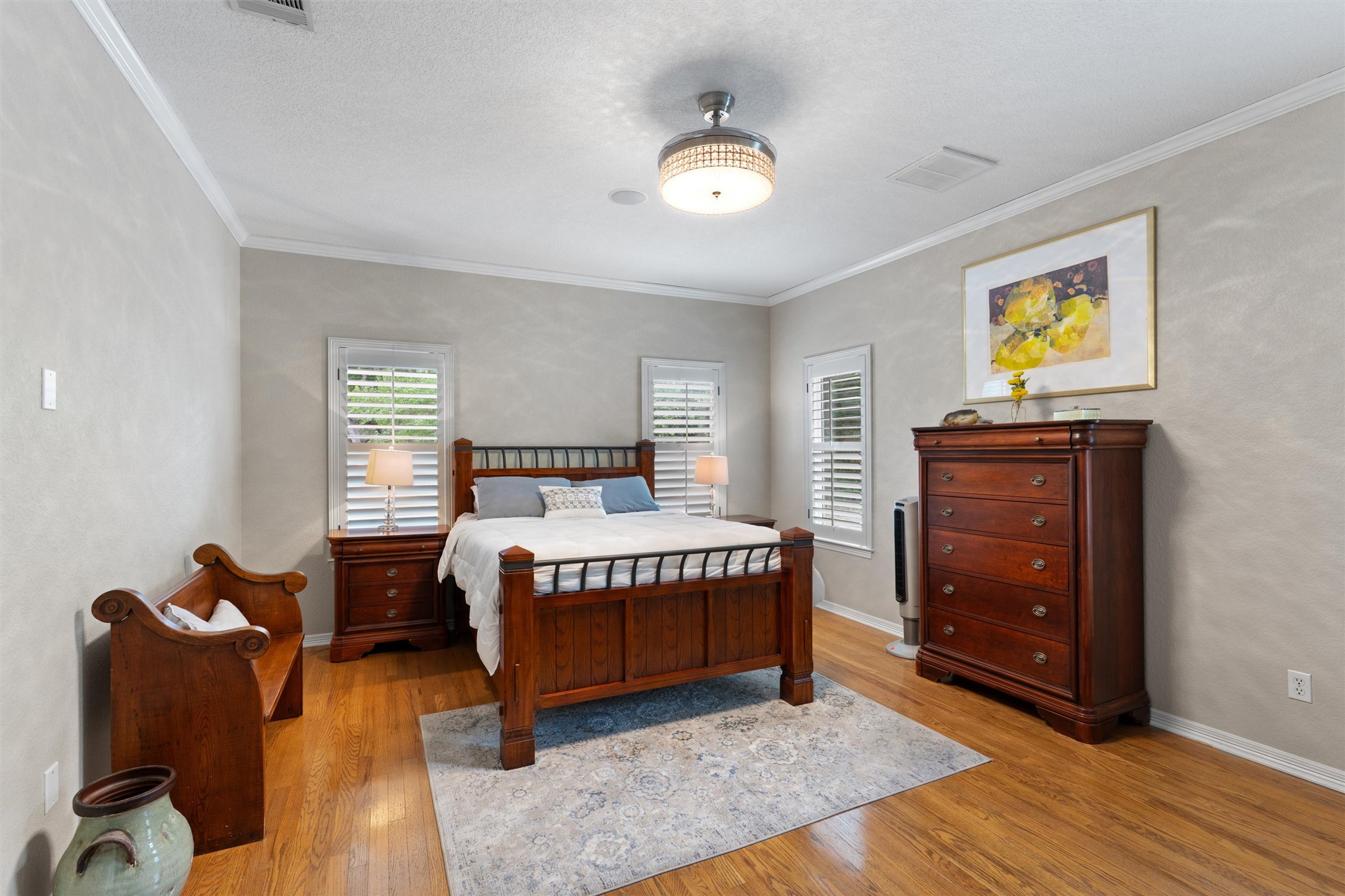 223 East Ridgewood Road Georgetown, TX 78633 - Photo 13 of 40 Hardwood floors and bright windows illuminate this comfortable bedroom retreat