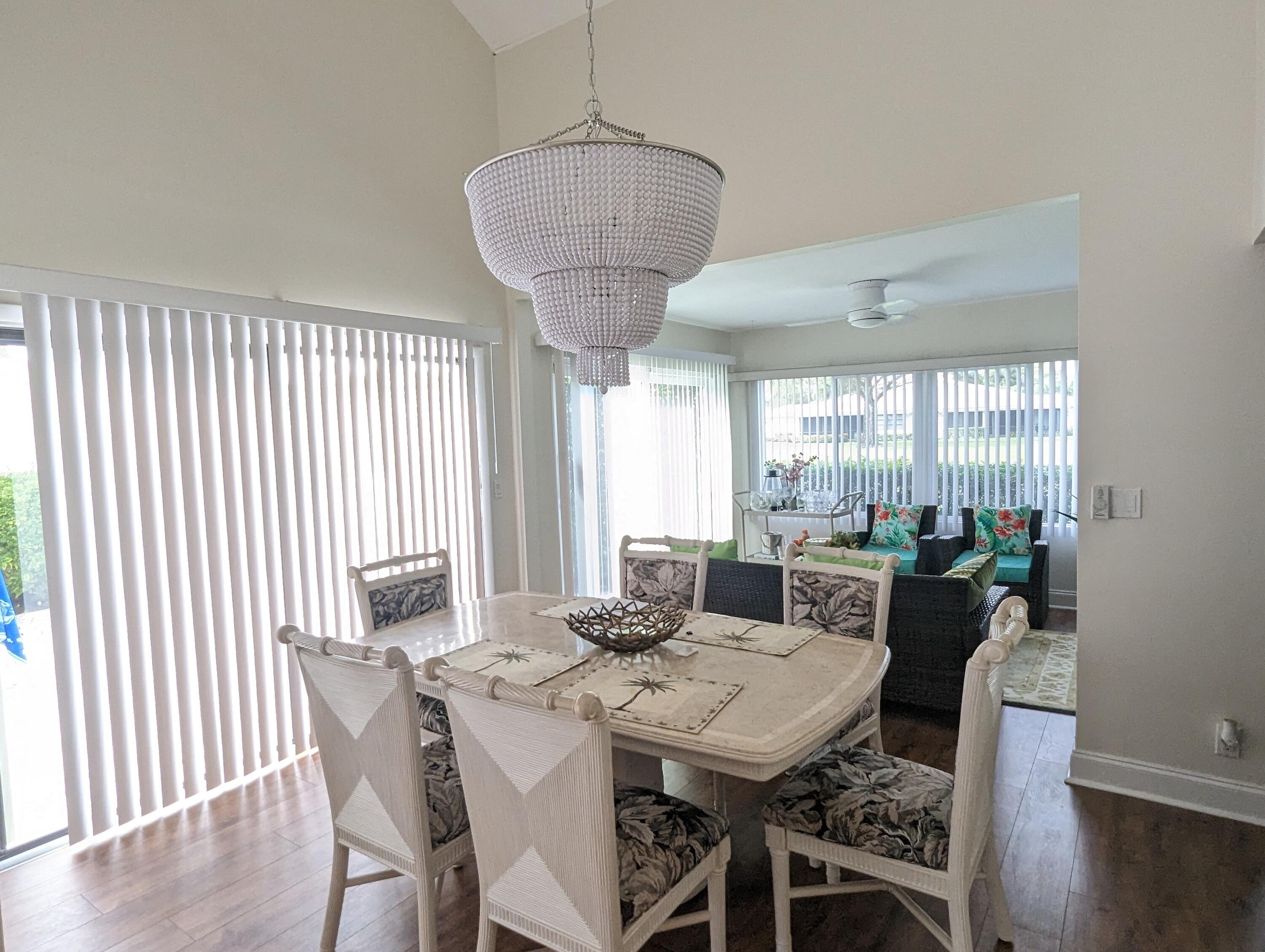 17042 Traverse Circle Jupiter, FL 33477 - Photo 6 of 30 a view of a dining room with furniture window and wooden floor