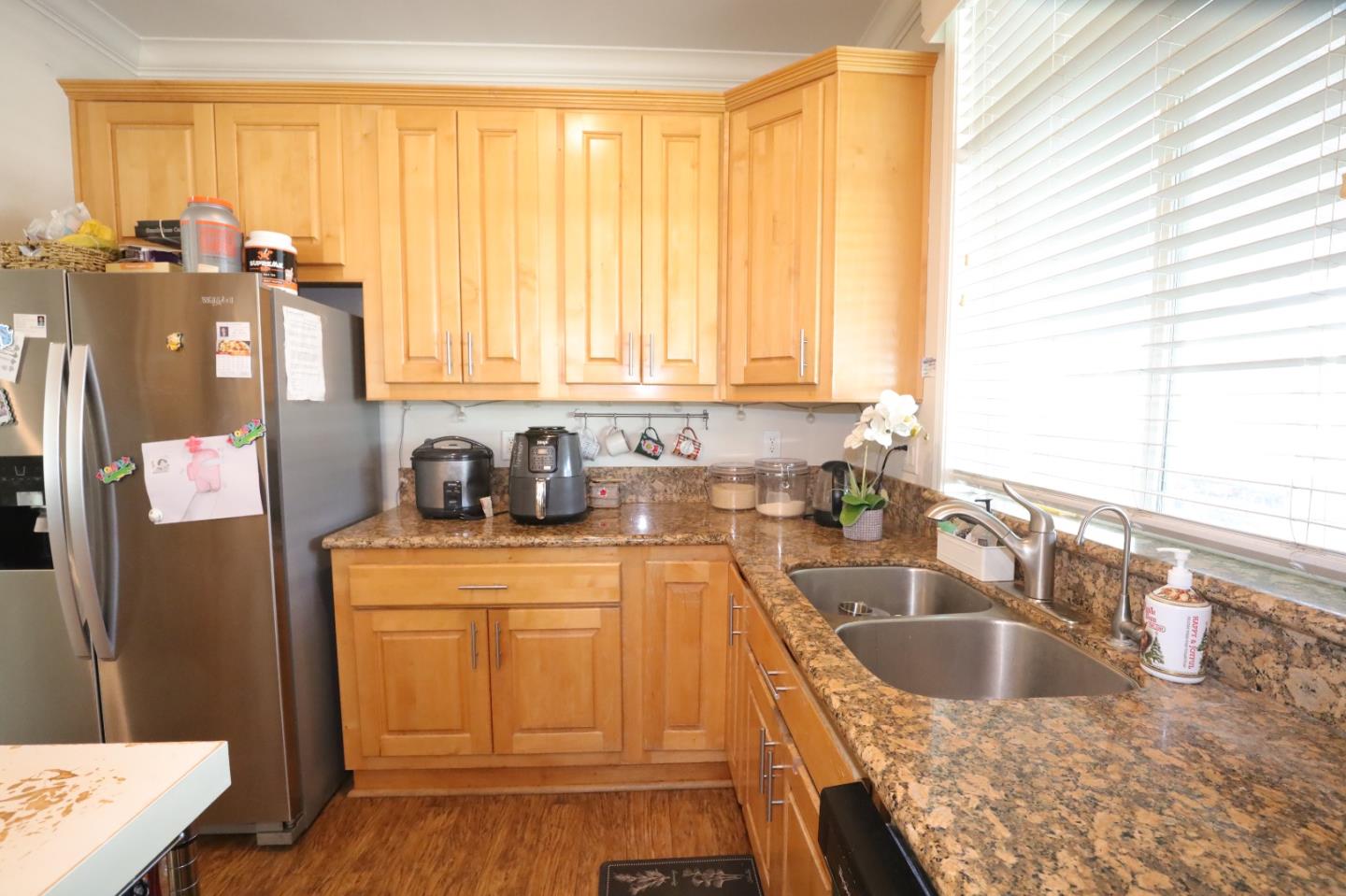 5450 Monterey Road, Unit 182 San Jose, CA 95111 - Photo 13 of 33 a kitchen with granite countertop a sink a counter top space and cabinets