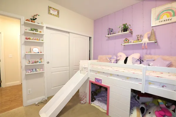 a spacious bathroom with a sink and a mirror