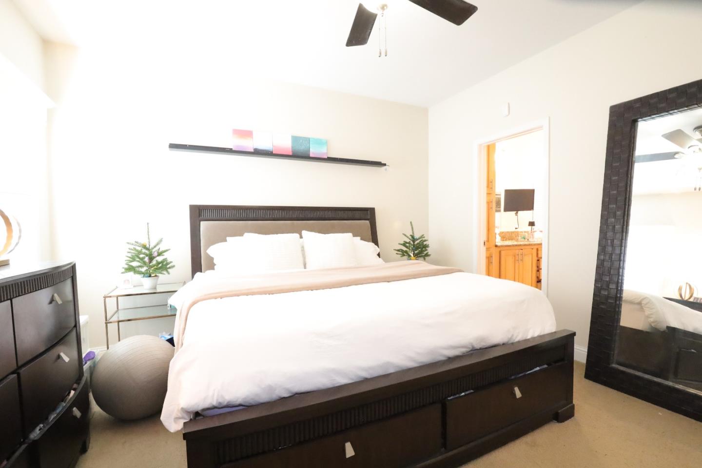 5450 Monterey Road, Unit 182 San Jose, CA 95111 - Photo 28 of 33 a bedroom with a bed and wooden floor