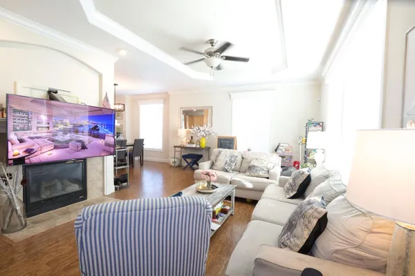 a living room with furniture and a fireplace