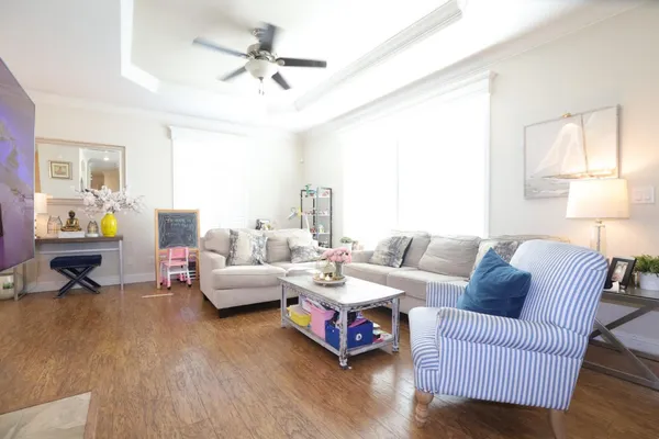a living room with furniture and a large window