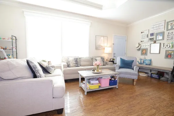 a living room with furniture and a large window