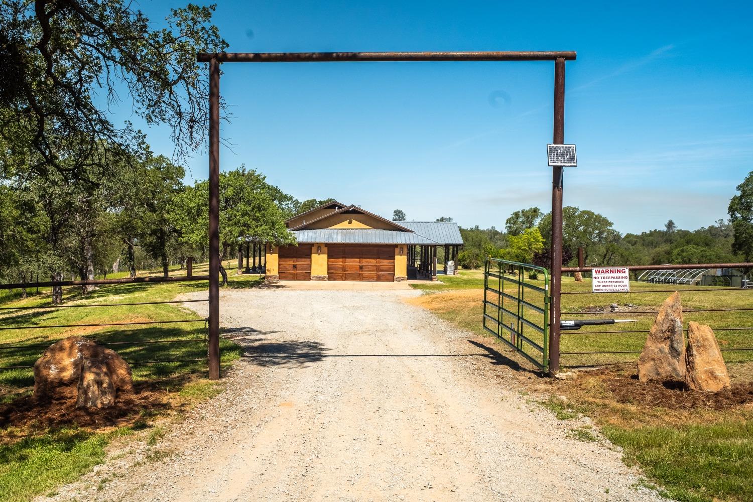 8591 Hogan Dam Road Valley Springs, CA 95252 - Photo 2 of 85 Main Ranch House with fenced yard