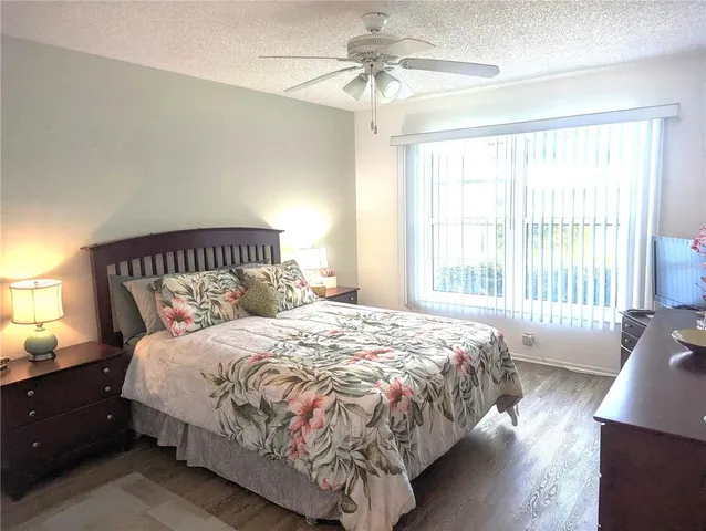 a bedroom with bed and window