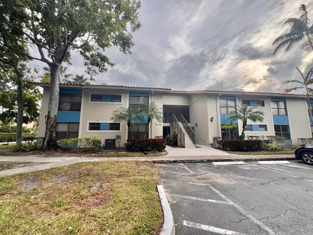 a view of a house with outdoor space and sitting area