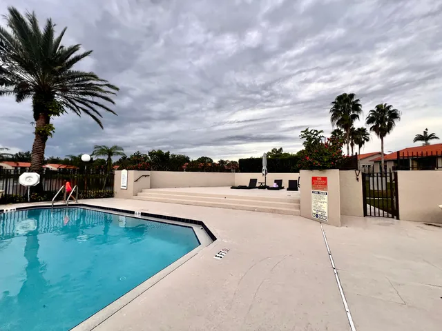 a view of swimming pool with a yard