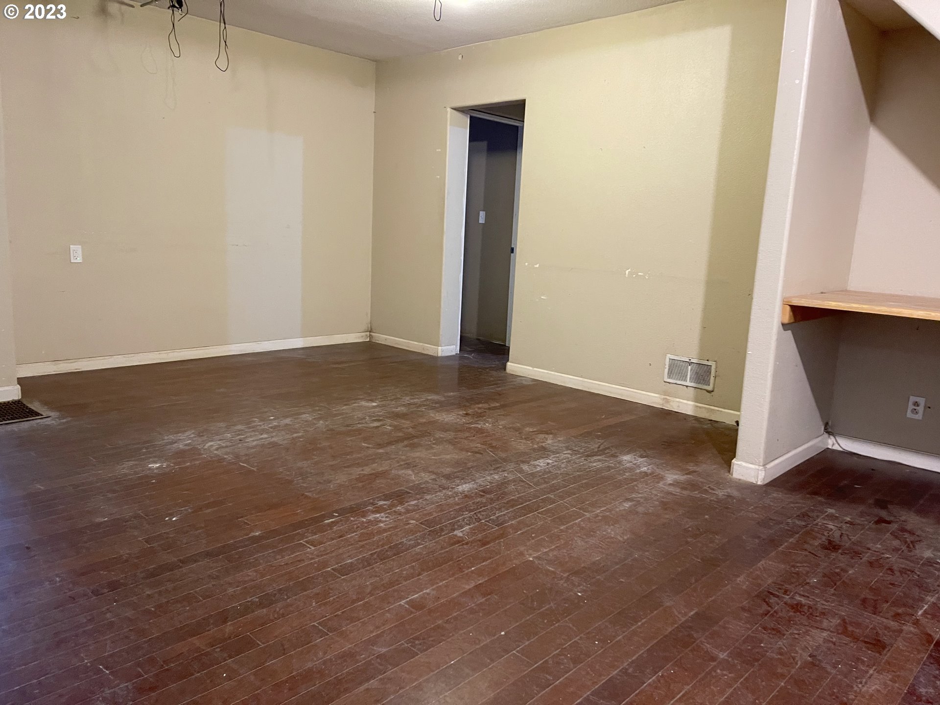 74479 Columbia River Highway Rainier, OR 97048 - Photo 16 of 21 a view of an empty room with wooden floor and a window
