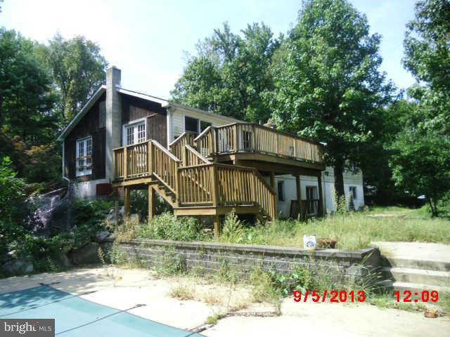 936 Parkey Road Gambrills, MD 21054 - Photo 2 of 2 a front view of a house with garden