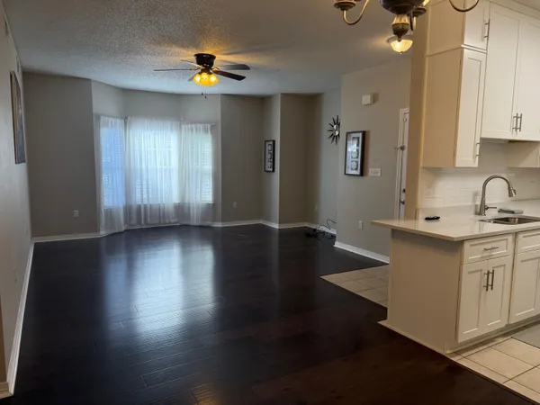 a kitchen with sink and cabinets