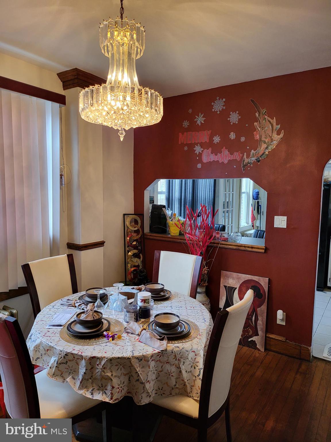 935 Howe Street Camden, NJ 08104 - Photo 3 of 14 a view of a dining room with furniture and wooden floor