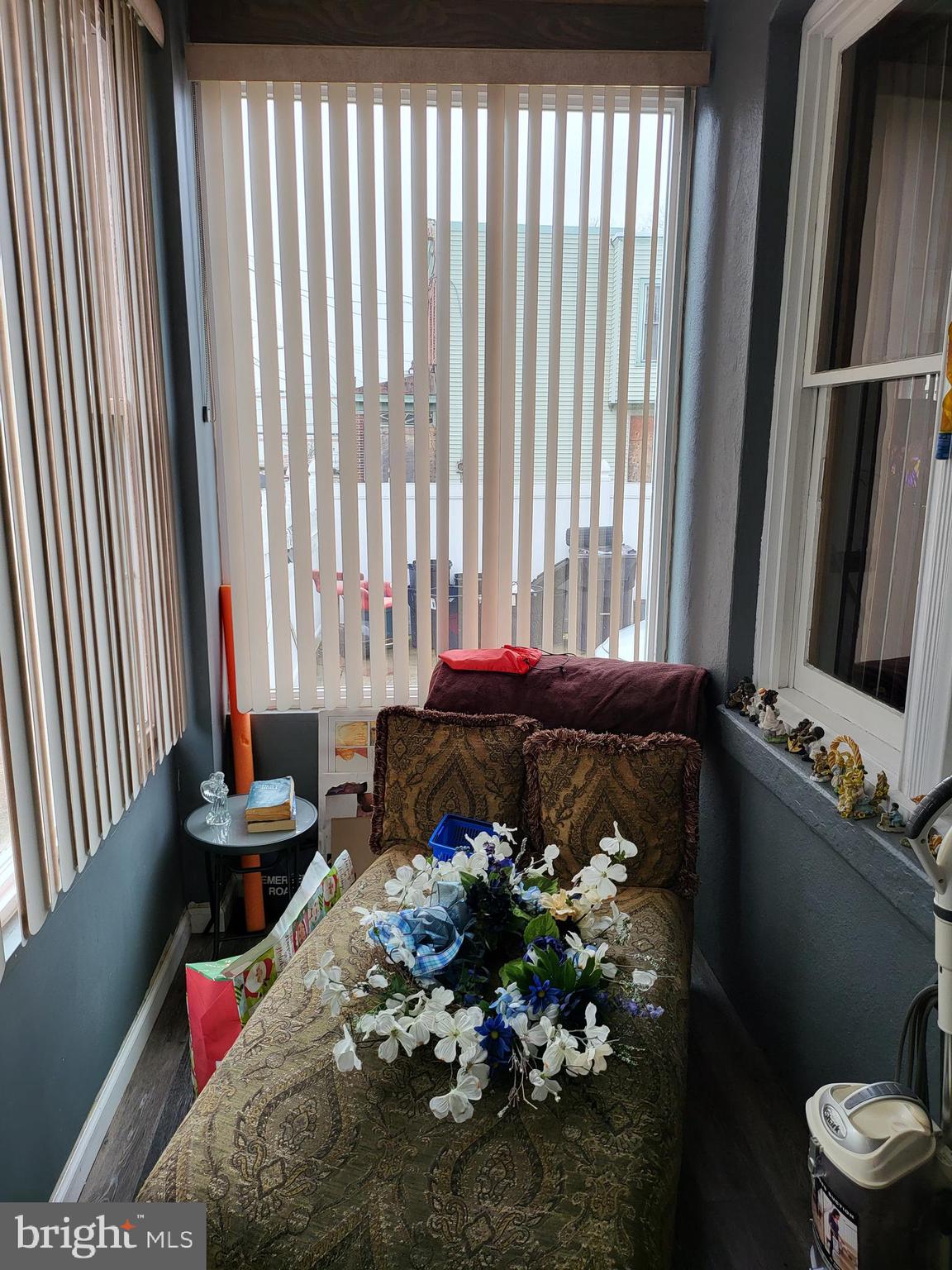 935 Howe Street Camden, NJ 08104 - Photo 4 of 14 a bed sitting in a bedroom next to a window