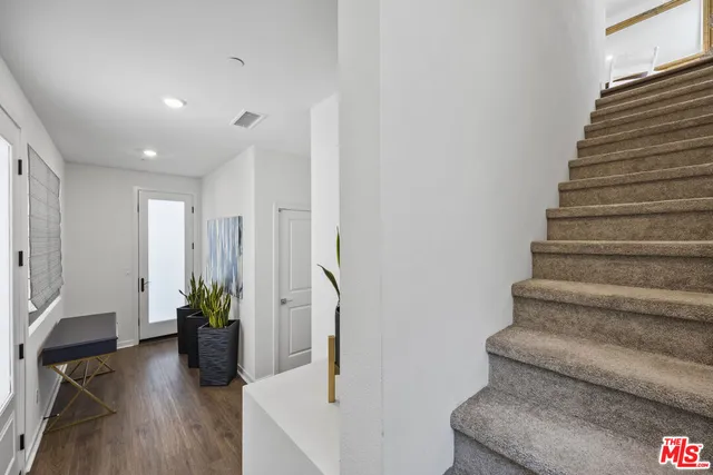 a view of entryway with wooden floor