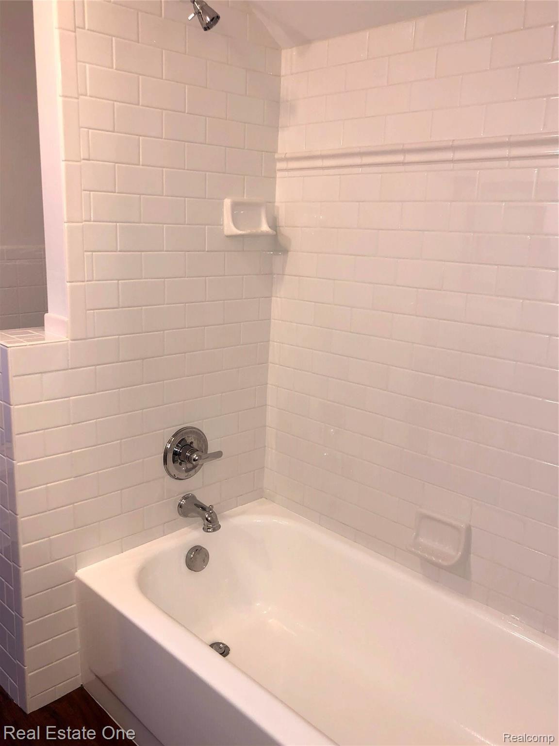235 Millville Road Lapeer, MI 48446 - Photo 42 of 48 Second floor bathroom new ceramic, subway tile.