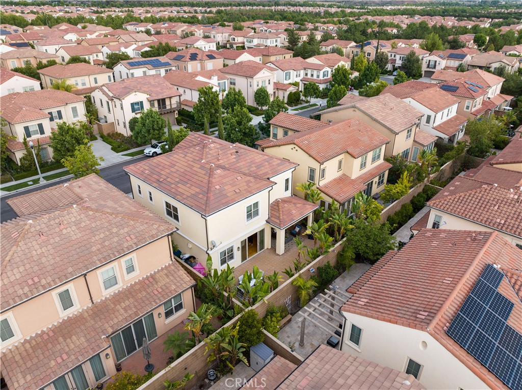 58 Elmdale Irvine, CA 92620 - Photo 2 of 16 an aerial view of multiple houses with a yard
