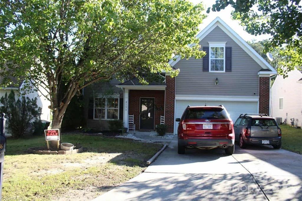 a view of a car in front of house