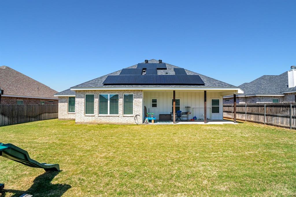 349 Garth Ridge Drive Abilene, TX 79602 - Photo 31 of 33 a view of a house with swimming pool and a yard