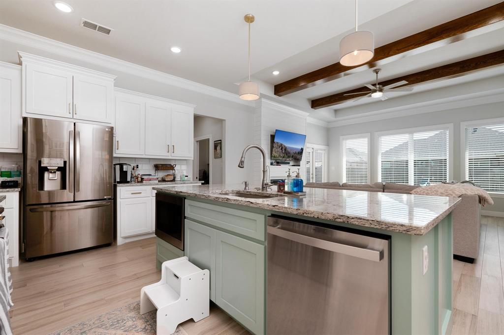 349 Garth Ridge Drive Abilene, TX 79602 - Photo 5 of 33 a kitchen with stainless steel appliances granite countertop a sink stove and refrigerator