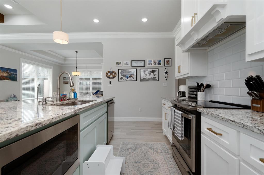 349 Garth Ridge Drive Abilene, TX 79602 - Photo 7 of 33 a kitchen with stainless steel appliances granite countertop a sink and stove