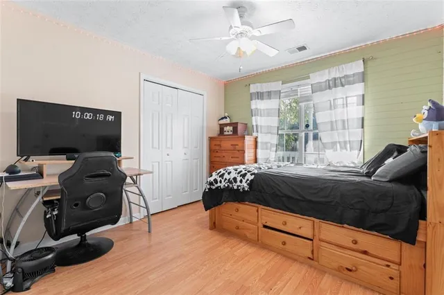 a bedroom with a bed and tv