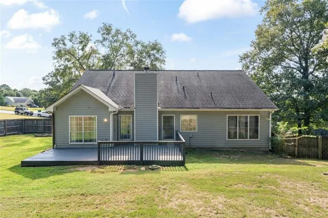 a front view of a house with a yard table and chairs