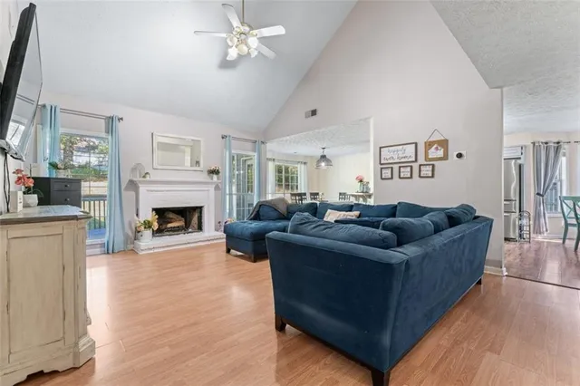 a living room with furniture fireplace and a flat screen tv
